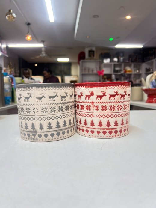 Festive holiday-themed cylindrical planter