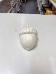 White ceramic acorn-shaped decor