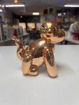 Glossy copper-toned ceramic balloon monkey figurine