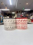 Festive holiday-themed cylindrical planter